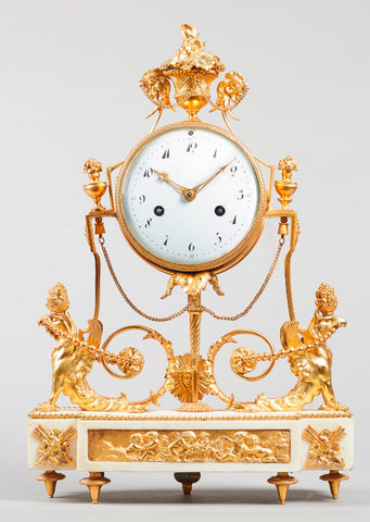 A late Louis XVI ormolu and white marble mantel clock Circa 1800